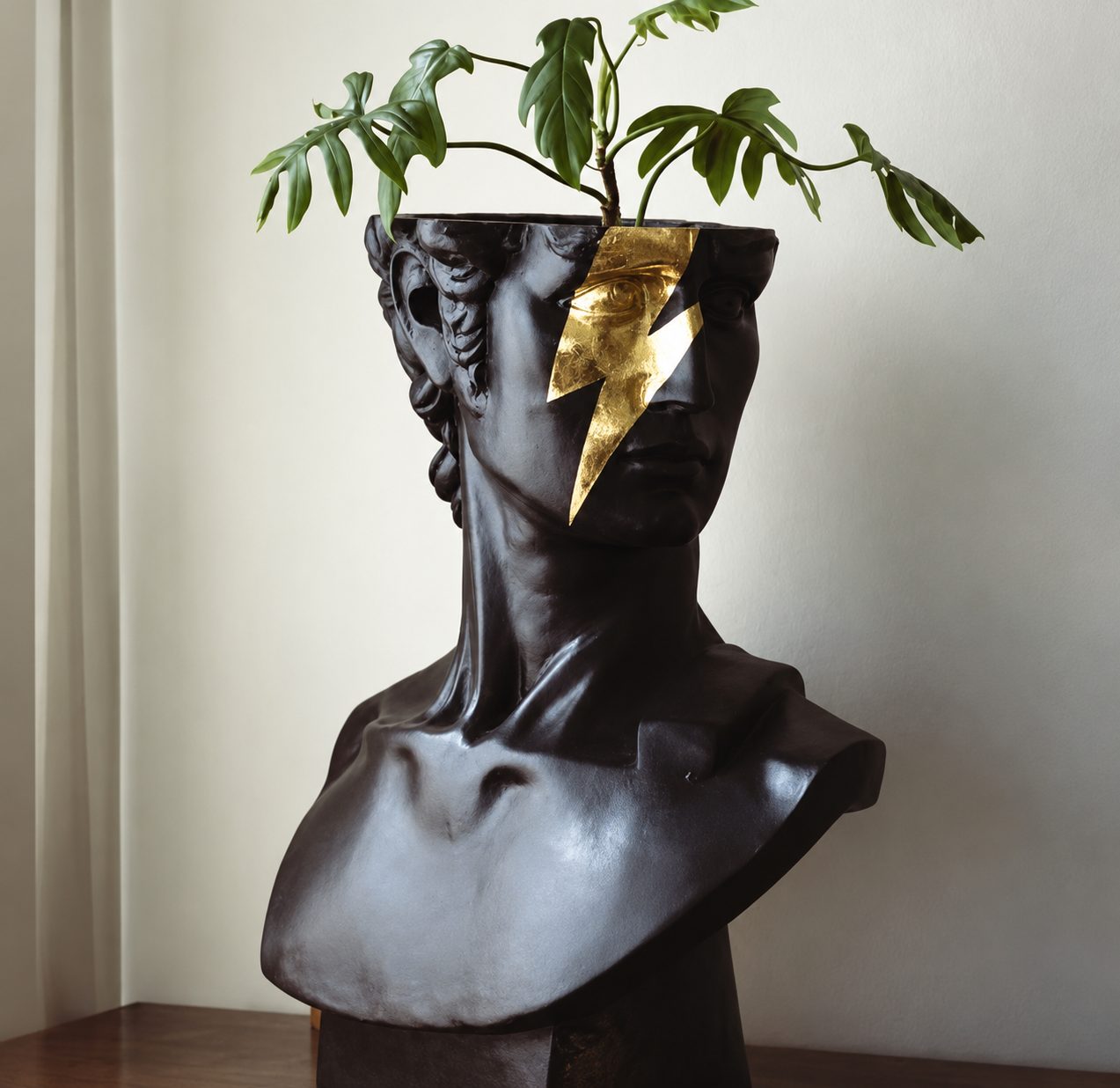 Gold lightning bust planter by Studio Haring
